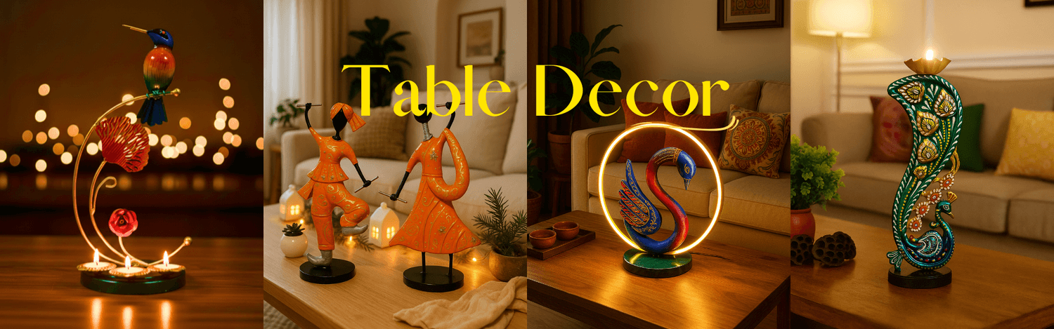 Handcrafted table decor featuring dancing couple figurines, swan LED lamp and peacock tea light holder by Manmohini Creations