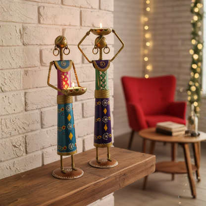 Decorative metal candle holder with handcrafted traditional figurines