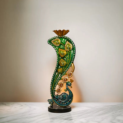 Metal candle holder featuring artistic peacock design and tealight holder